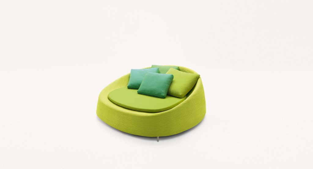 Green Afra Large seat, upholstery structure of rope cord sewn with a spiral-like pattern, seat cushion in fabric on a white background.