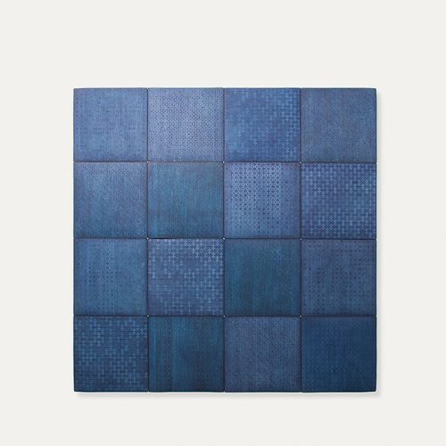 Ebanys rug made of blue square modules on a white background.