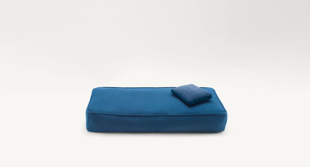 Float Outdoor Pouf, upholstery in blue fabrics on a white background.