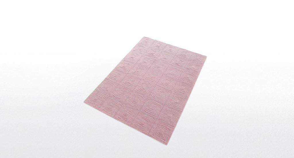 Imperfetto of pink square felt. The embroidery on each element creates an irregular squared spiral-like pattern on a white background.