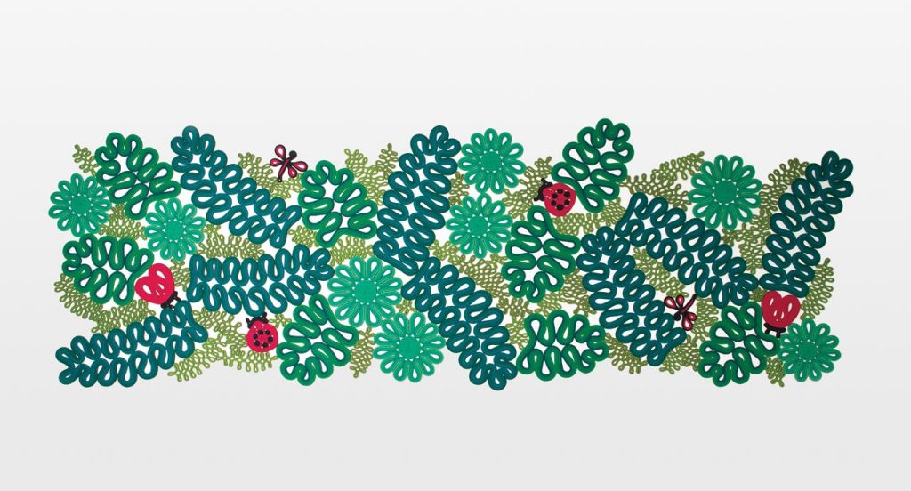 Ladybird rug, plants and animals like pattern in color green, black, and red on a white background.