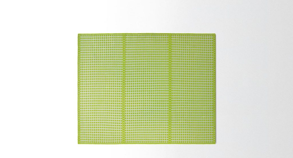 Orto rug, embriodery made of white and green flat braids on a white background.