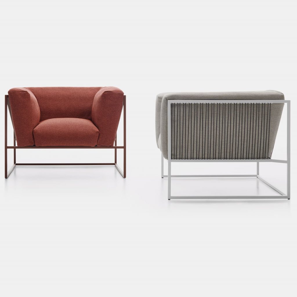 Two Arpa armchairs. Backrest and seat one in brown and one in white loadbearing structure in stainless steel. The backrest frame is woven using white high tensile polyester cord. The back and seat cushions are made of Dryfeel, the left one in corten match, the right one in grey on a white background.
