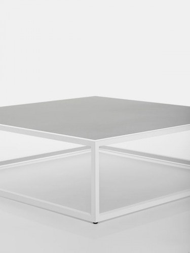 Arpa Low Table, Loadbearing structure in stainless steel,Top in matt light grey calce ceramic, Structure in matt white goffered painted on a white background.