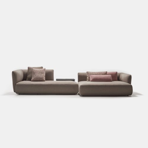 A brown Cosy sofa made of two padded modular elements, one with the high back on de right and one on the left on a white background.