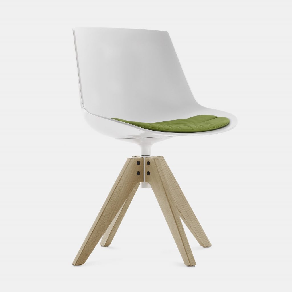 A white and green Flow Chair Padded with a natural wooden bottom on a white room background.