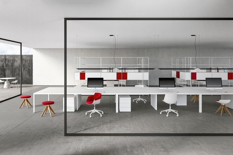 Three white flow chairs with a red padding and five white point star legs on a office background.