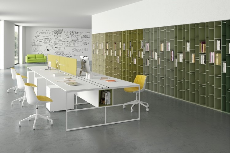 Four yellow Flow Chairs with a white bottom on a office background.