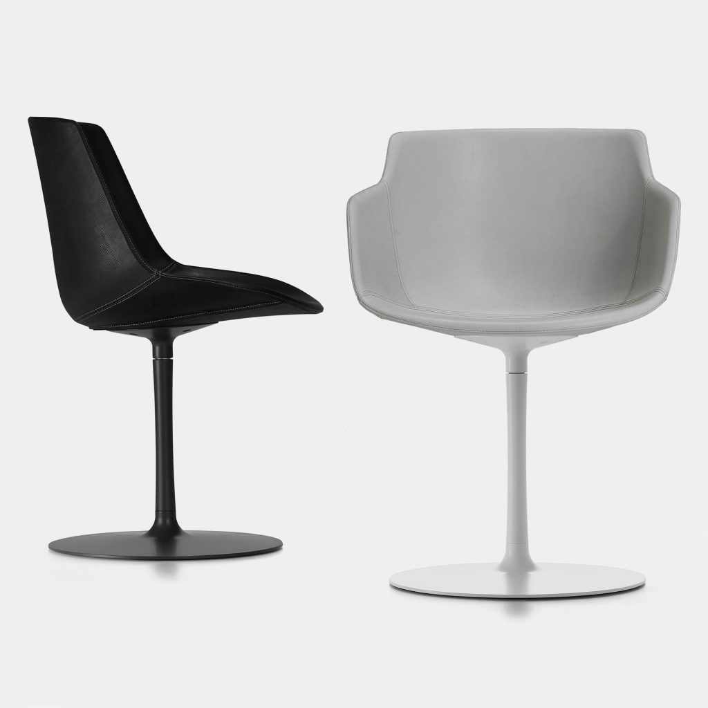Two flow leather chairs, one in black colour and one in white colour on a white background