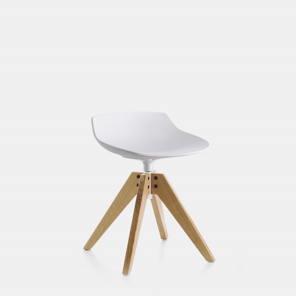 A Flow stool in matte white with four-legged base in natural oak on a white background.