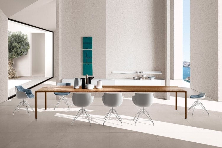 Six white Flow stools with four-legged base on a white dining room backgorund.