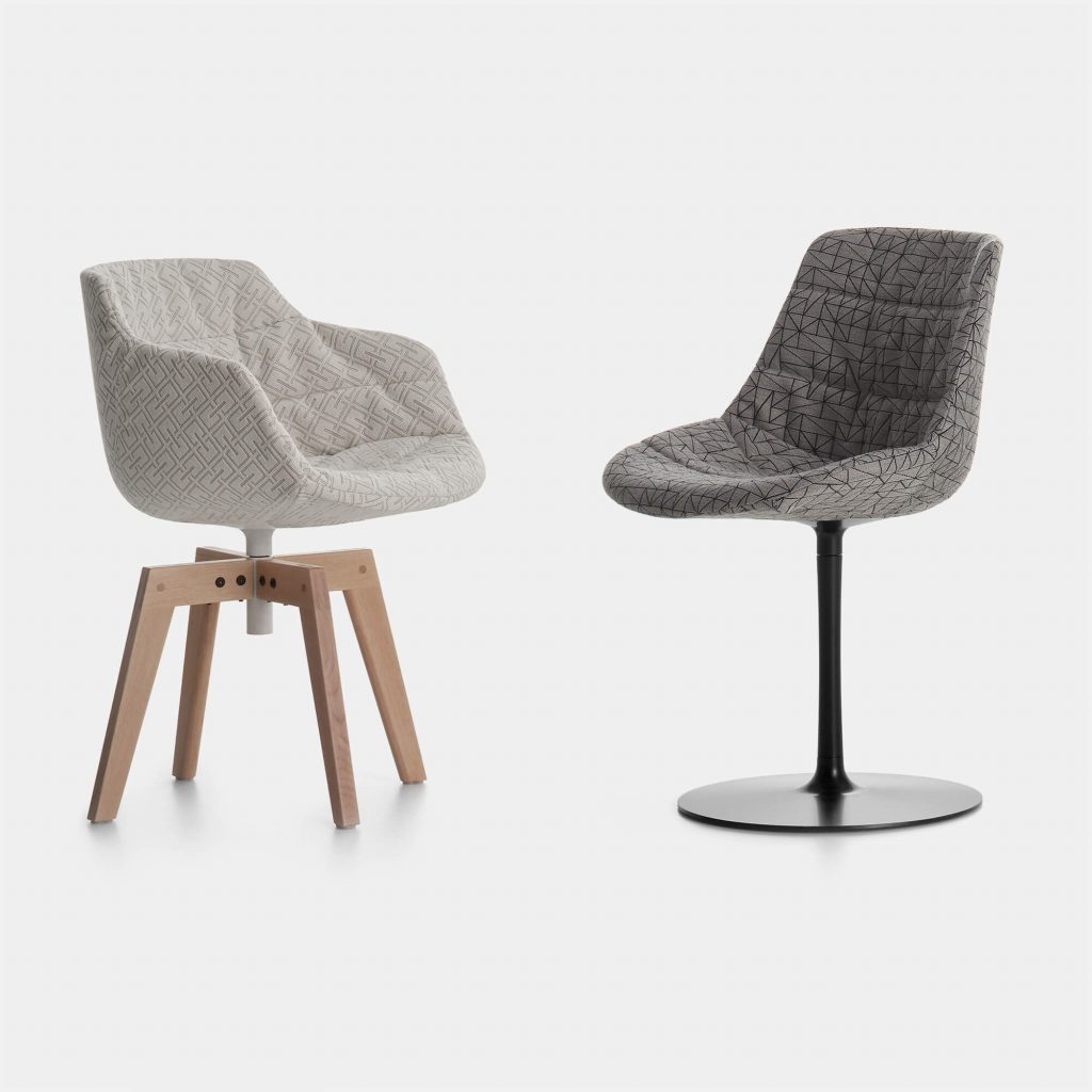 Two Flow Textile Chairs, one in grey pattern with four-legged in natural oak and one in grey pattern with a central leg on a white background.