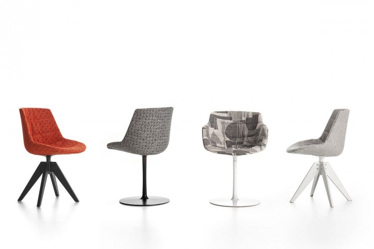 Four Flow Textile chairs, one in orange pattern with four-legged in black steel, one in grey pattern with a central leg, one in gray pattern with four-legged steel in white and one in grey pattern with a white central leg on a white background.