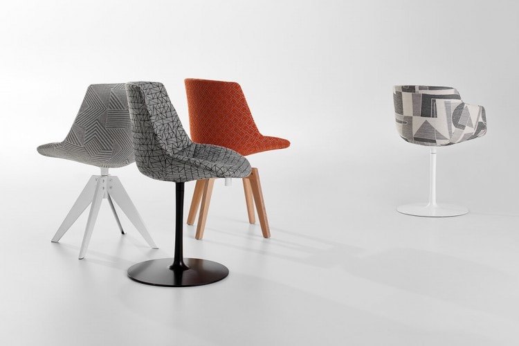 Four Flow Textile chairs, one in orange pattern with four-legged in natual oak, one in grey pattern with a central leg, one in gray pattern with four-legged steel in white and one in grey pattern with a white central leg on a white background.
