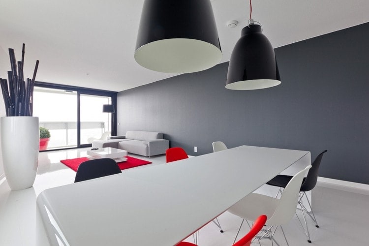 One La Grande Table made with a curved aluminium sheet. Finish in gloss white lacquered on a dining room background.