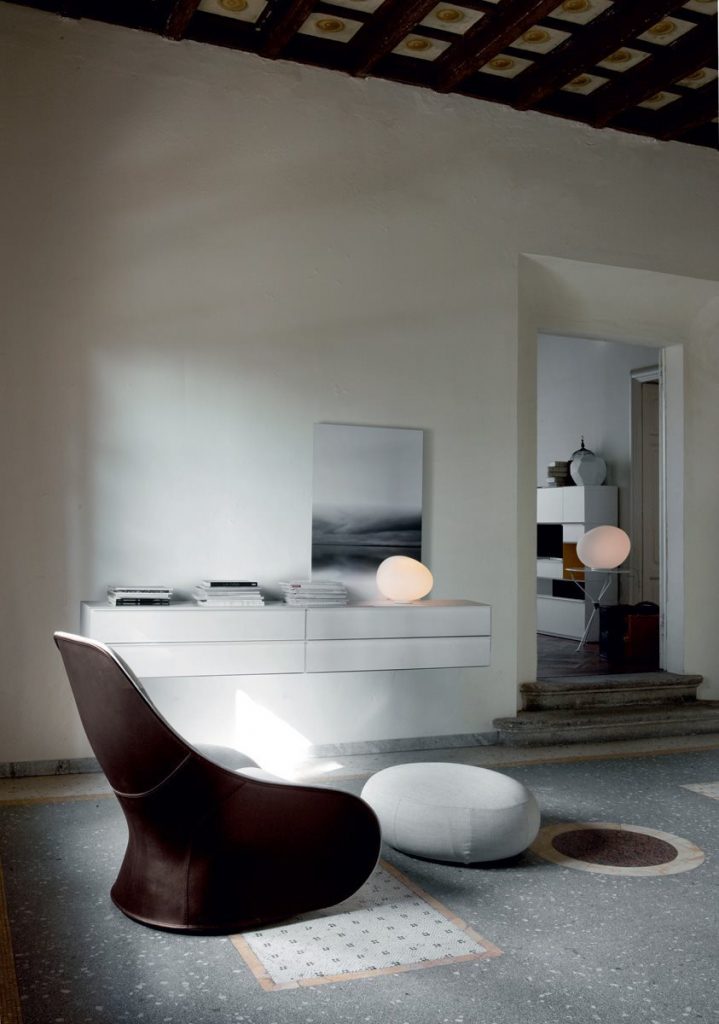 Derby armchair upholstered seat and backrest in white and brown in a living room.