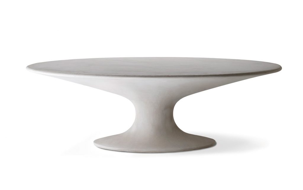Fenice table with an oval top and oval central leg in white on a white background.
