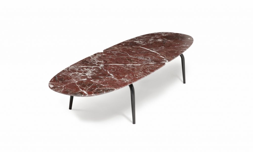 Graphium coffee table. Oval white and brown marble top and four black legs on a white background.