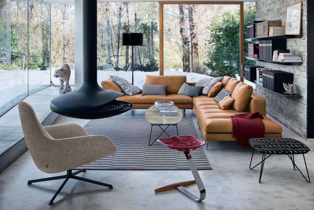 Mezzadro red stool with a unique design, featuring a red seat on a chrome base in a living room.