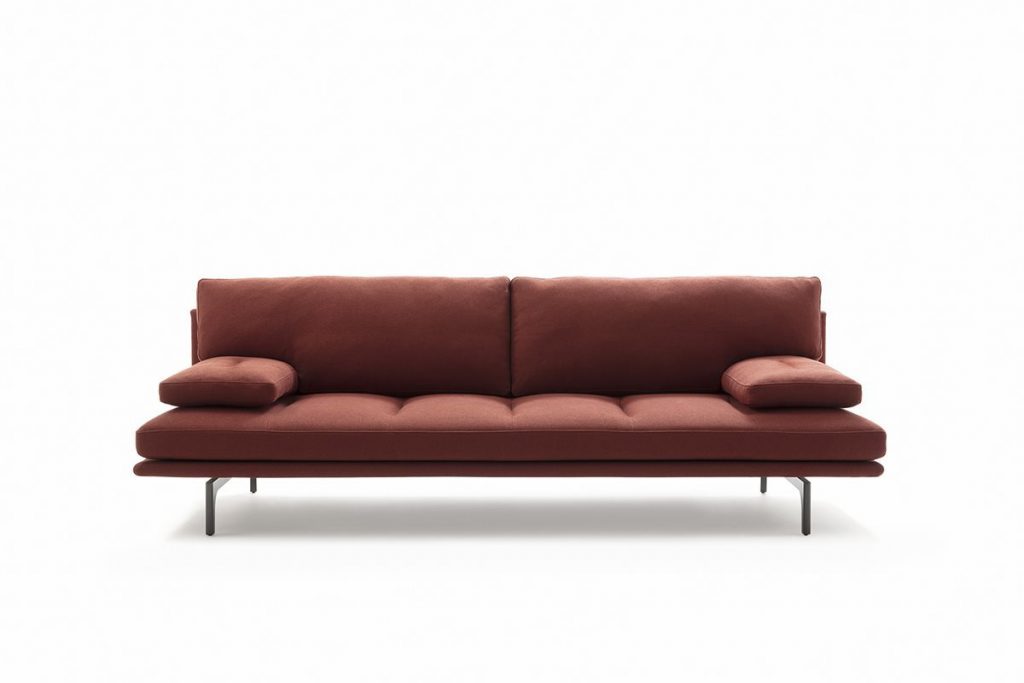 Red Milano+ sofa with armrest and backrest and a black metal frame on a white background.