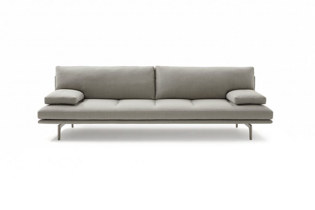 Gray Milano+ sofa with armrest and backrest and a black metal frame on a white background.