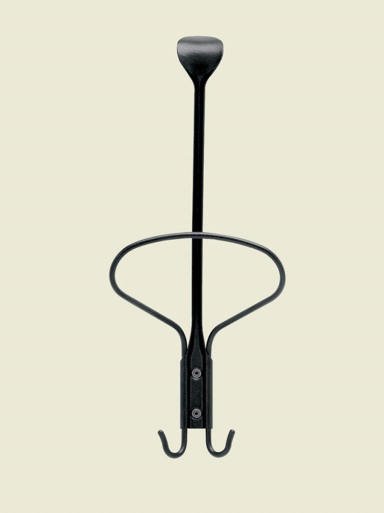 Museo coat hanger in black metal frame with irregular shape on a white wall.