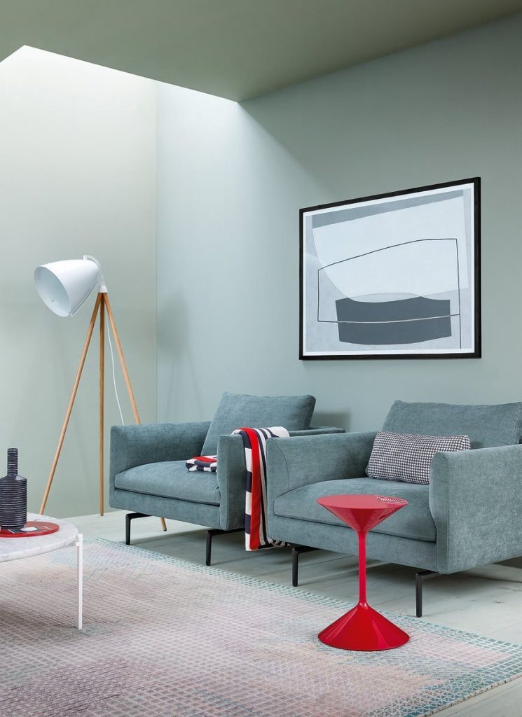 Tempo coffee table, round top and base in red in a living room.