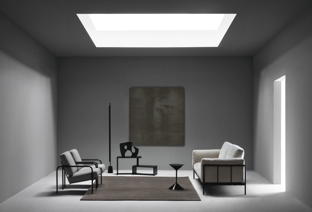 Tempo coffee table, round top and base in black in a living room.