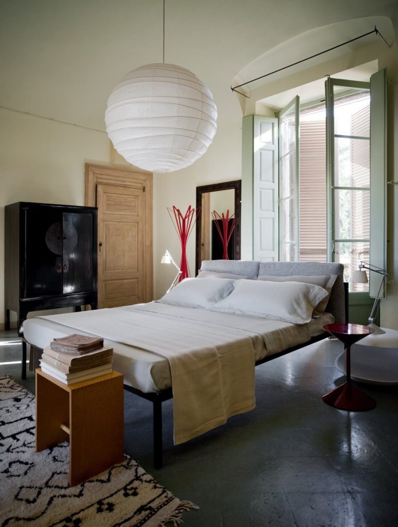 Tempo coffee table, round top and base in a bedroom.