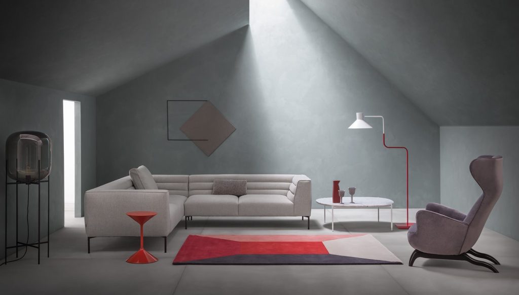 Tempo coffee table, round top and base in red in a living room.