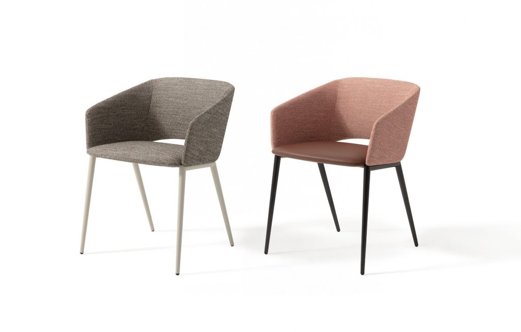 Two Tusa 2261/B chairs with a curved backrest and seat upholstered in gray and orange fabric on a white background.