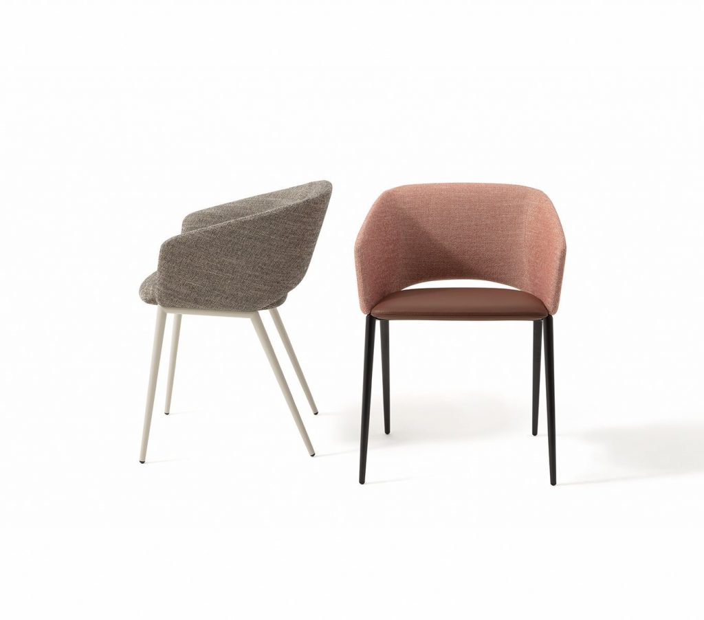 Two Tusa 2261/B chairs with a curved backrest and seat upholstered in gray and orange fabric on a white background.