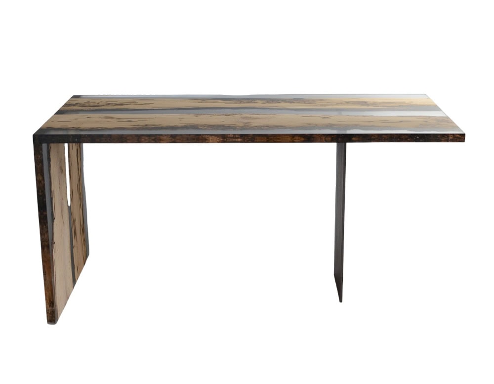 Bent Desk blends raw wood with clear resin in a sleek form, creating a modern workspace that highlights natural textures while maintaining clean, geometric lines.