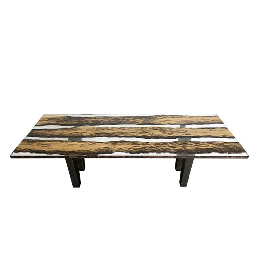 A striking dining table crafted from reclaimed oak and clear resin, highlighting the raw grain and natural voids of the wood. The piece combines rustic texture with modern transparency for a refined yet organic look.