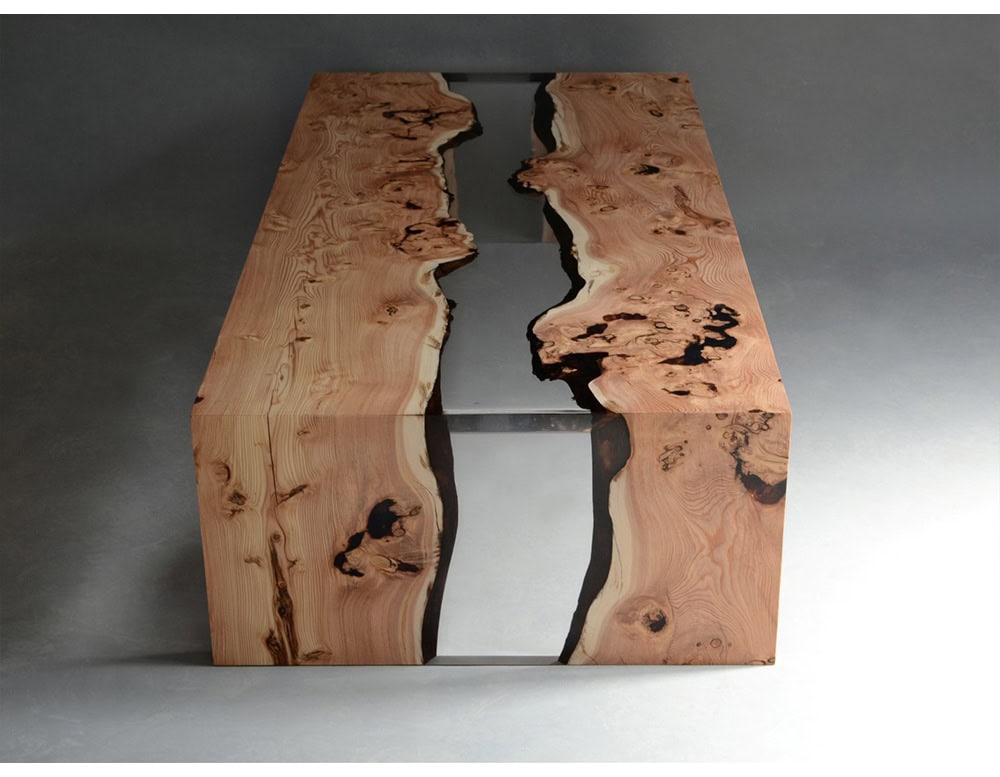 This coffee table highlights the raw beauty of natural wood combined with clear resin, forming a striking river-like centerpiece. Its organic edges and polished surface create a bold yet elegant statement for modern interiors.