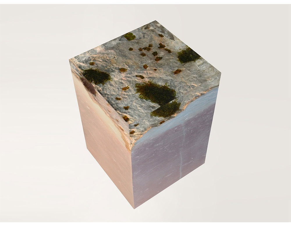 This stool captures the rugged beauty of natural stone, blending rocky textures with soft moss accents. Its cubic form offers both sculptural presence and practical seating.
