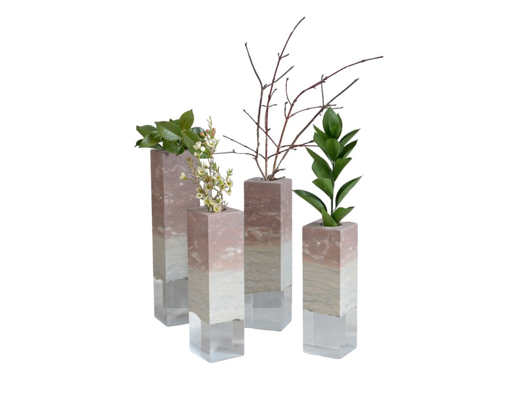 These tall, geometric vases are crafted in layered Dolomyth resin, blending earthy tones with a translucent base. Their sleek, modern design makes them striking decorative accents, ideal for displaying flowers or branches.