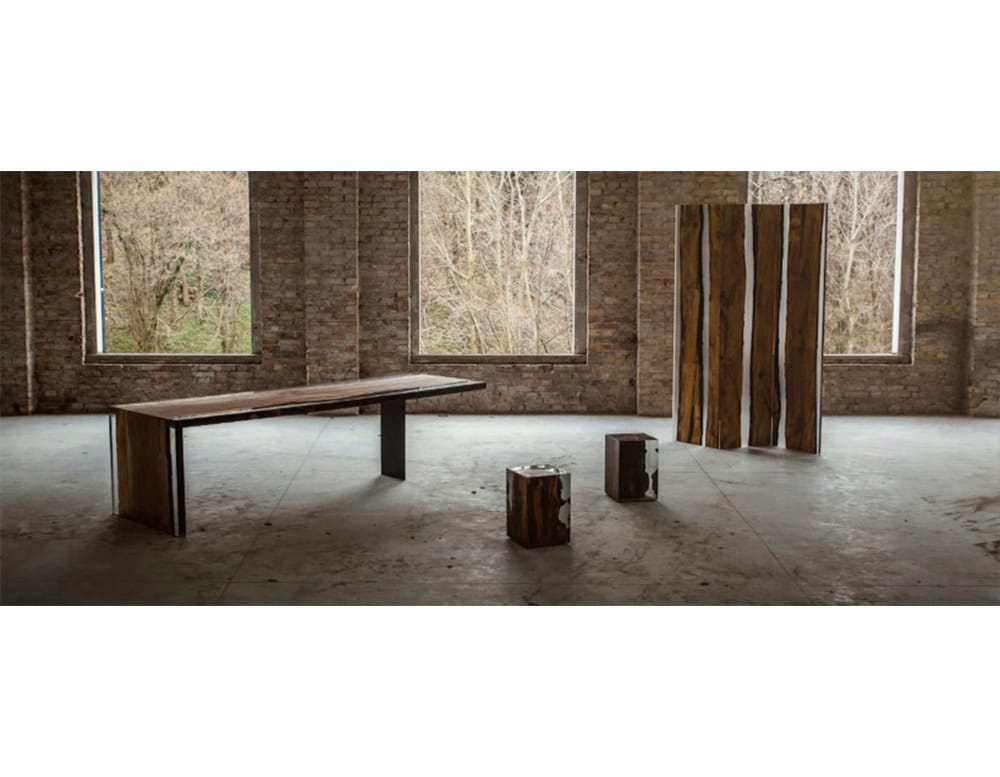 The Fungi Stool encases raw wood and fungi textures in clear resin, preserving organic forms while adding a sleek, modern finish. Its sculptural design works as both a seat and a striking accent piece.