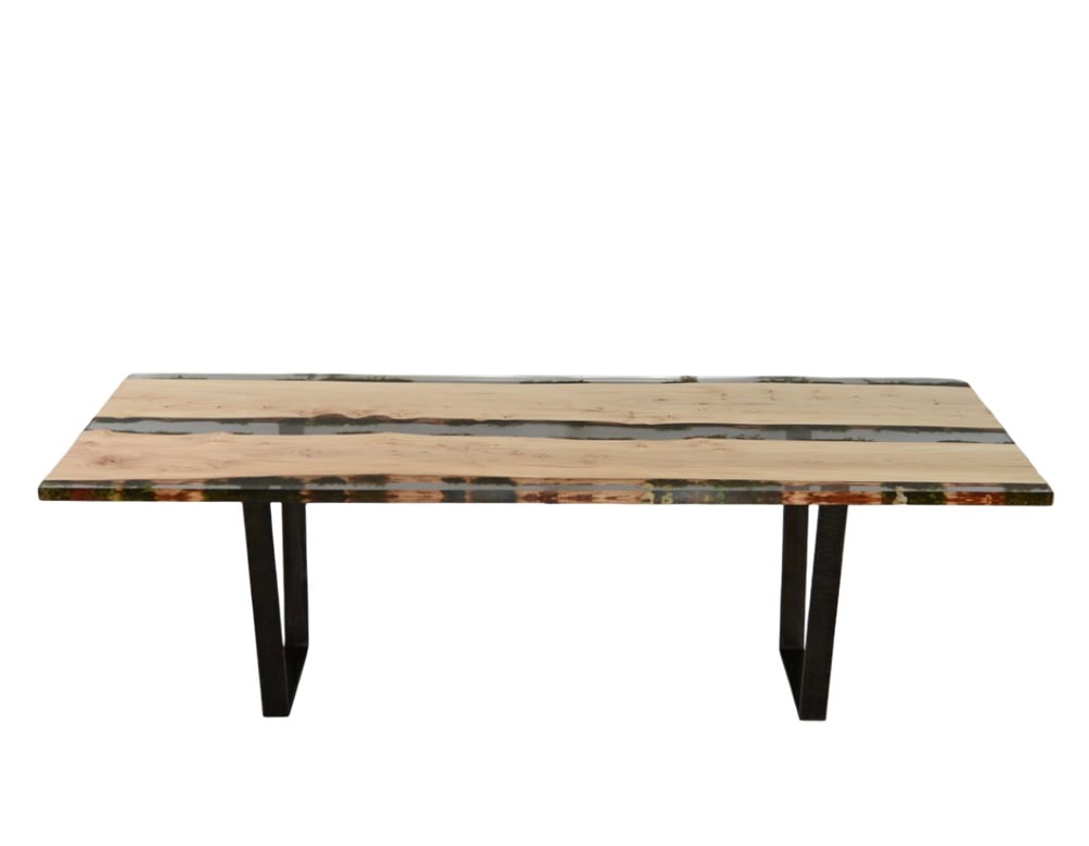 Moss Table blends natural wood and preserved moss encased in resin, creating a striking balance of organic textures and modern transparency. Supported by sleek metal legs, it’s a sculptural and functional centerpiece.