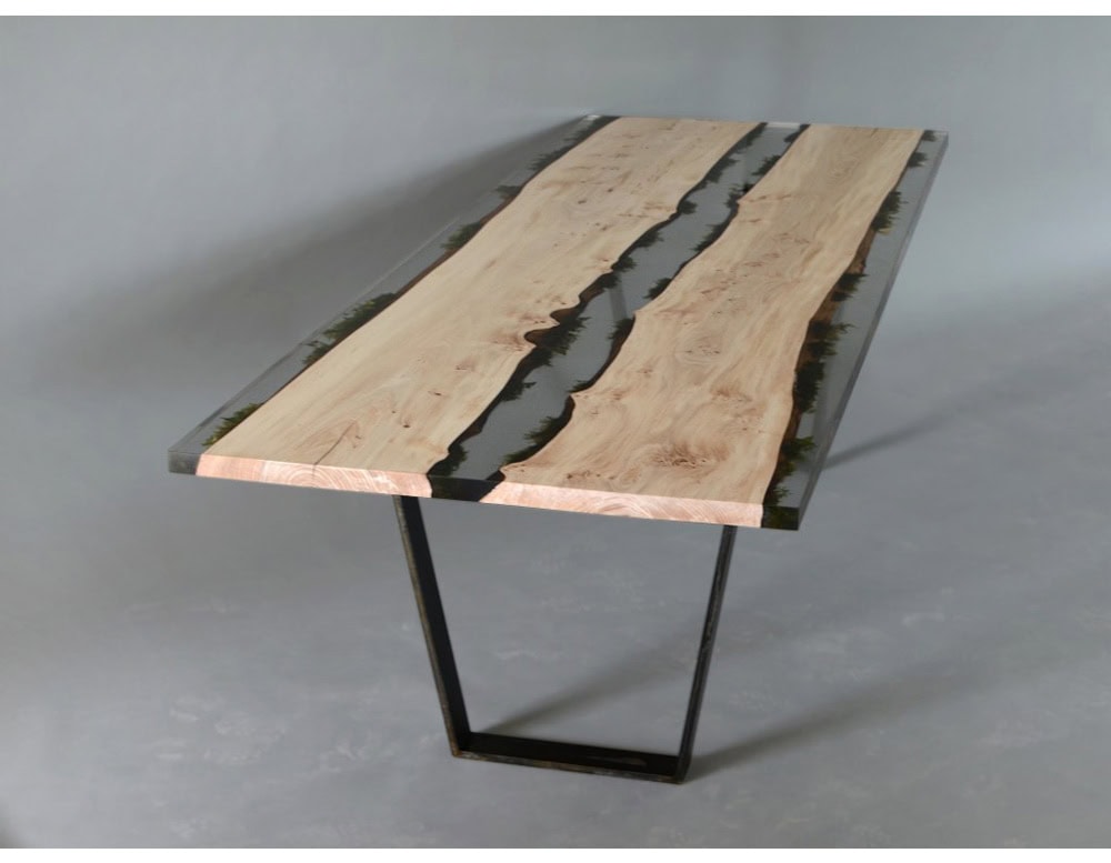 This table combines natural wood slabs with clear resin, embedding moss between the panels. The result is a striking design that merges organic textures with a modern aesthetic, making it both functional and sculptural.
