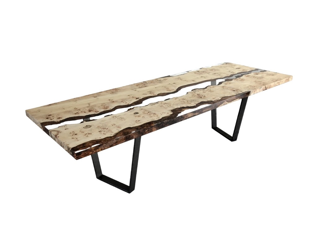 Poplar Reef Table features live edge poplar slabs divided by a clear resin channel, creating a river like effect. Resting on angular metal legs, it merges organic beauty with sleek modern structure.