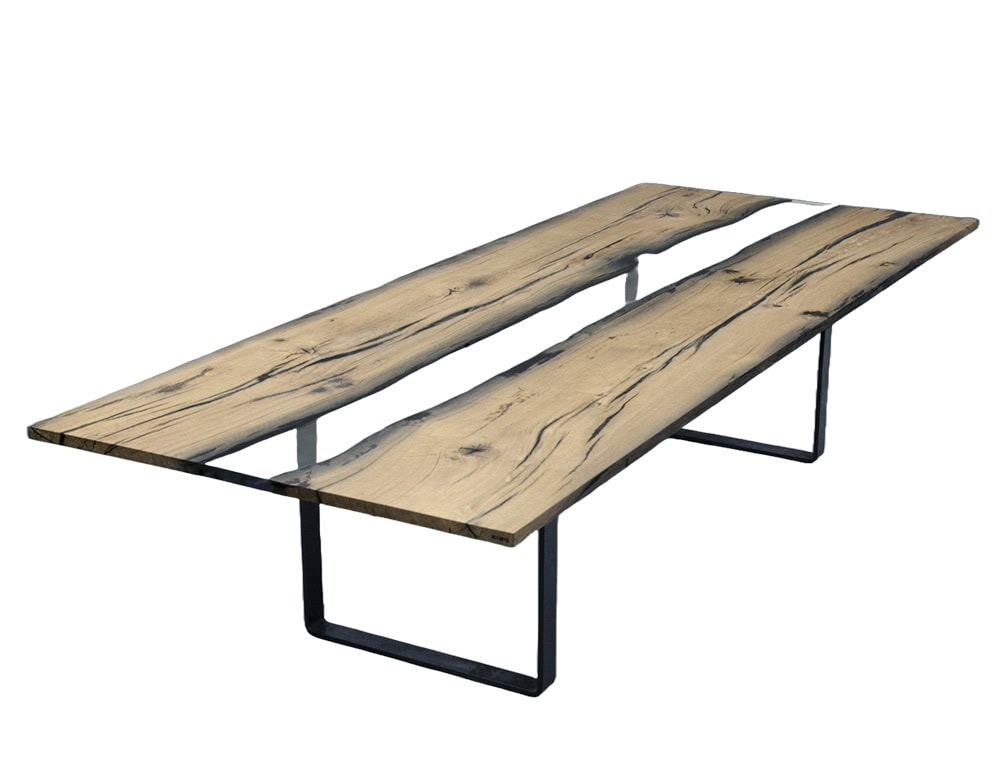 Wetland Dining Table features twin planks of natural wood seamlessly joined by clear resin. Its clean lines and metal base highlight a refined contrast of organic warmth and modern precision.