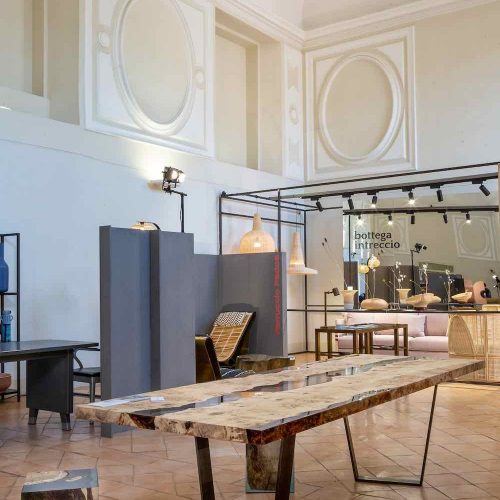 table made of a two-tone wooden base and covered with resin in half in a room