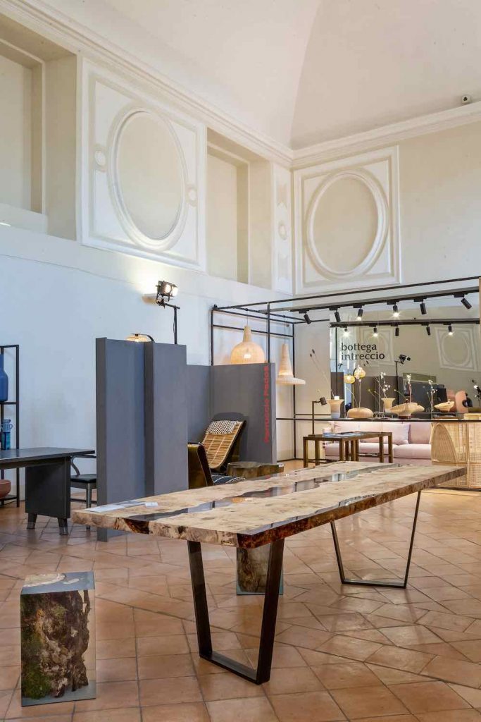 table made of a two-tone wooden base and covered with resin in half in a room