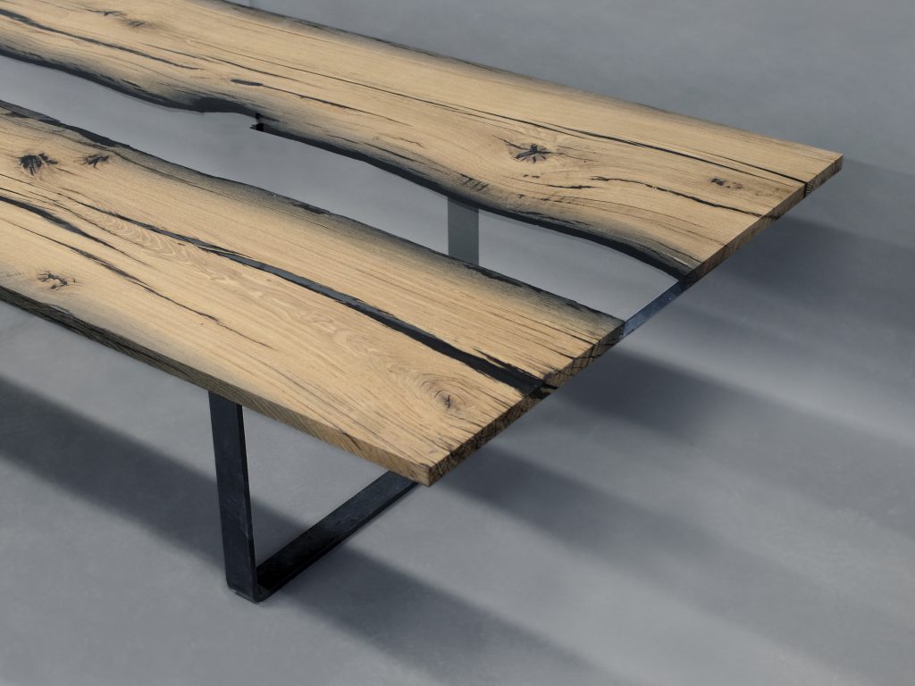 table made of wood and resin base in a light brown tone on a steel base