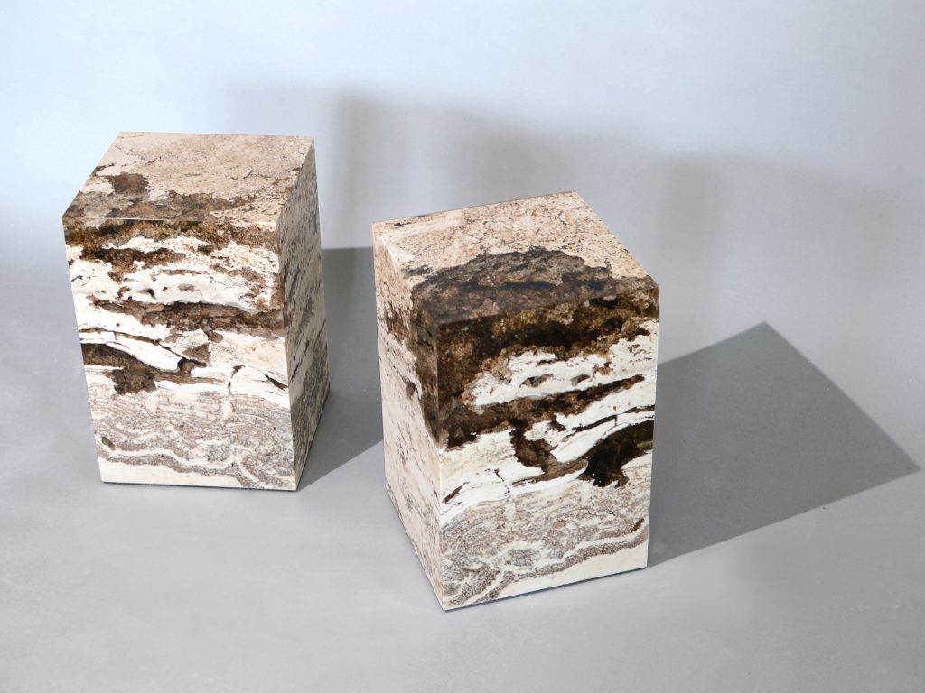 small sculpture made of natural stone covered in resin completely in a tone of brown and beige