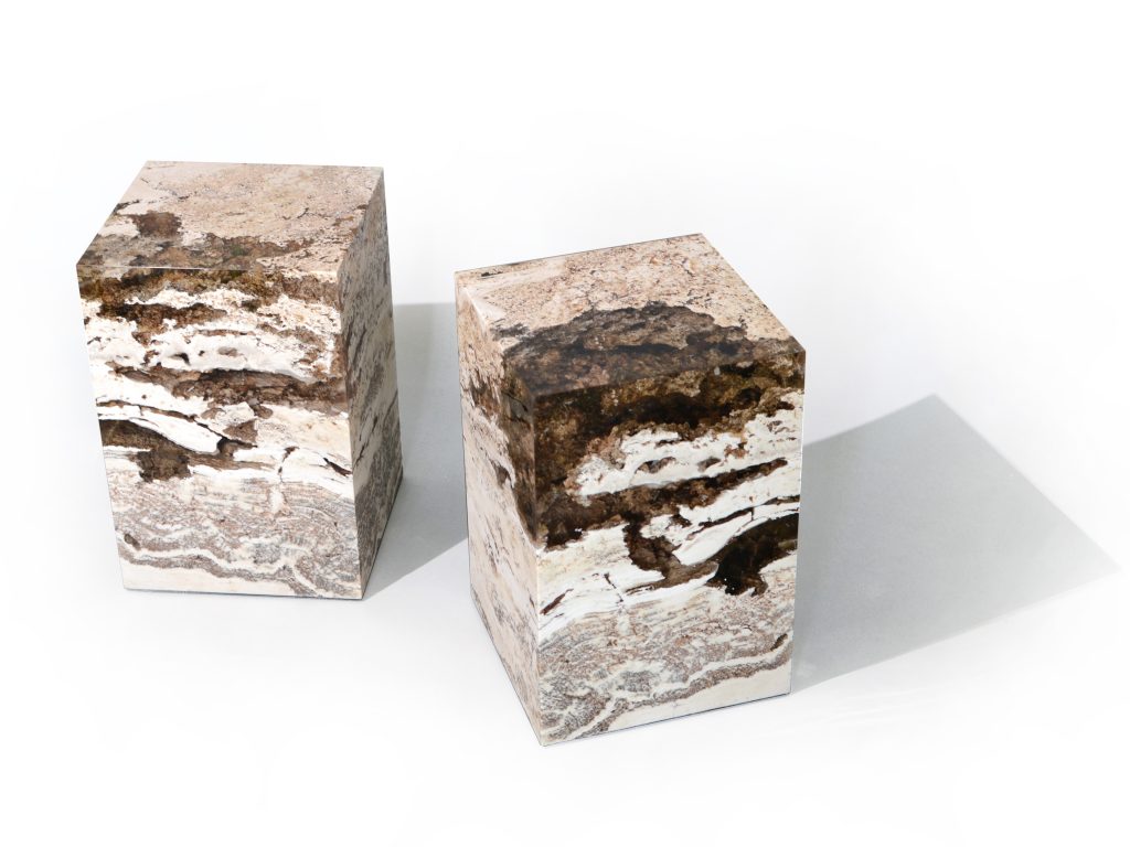 small sculpture made of natural stone covered in resin completely in a tone of brown and beige on a white background
