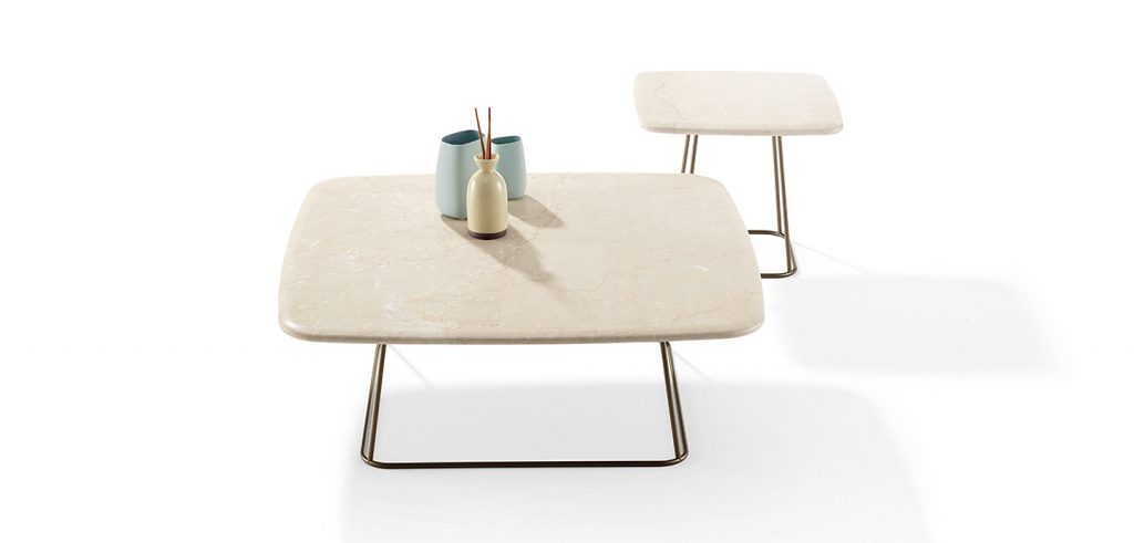 two side tables made of gold steel base and beige marble top on a white background