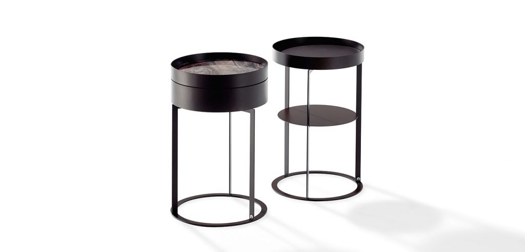 nightstand with compartment made of cylinder-shaped brass base in a tan color tone on a white background