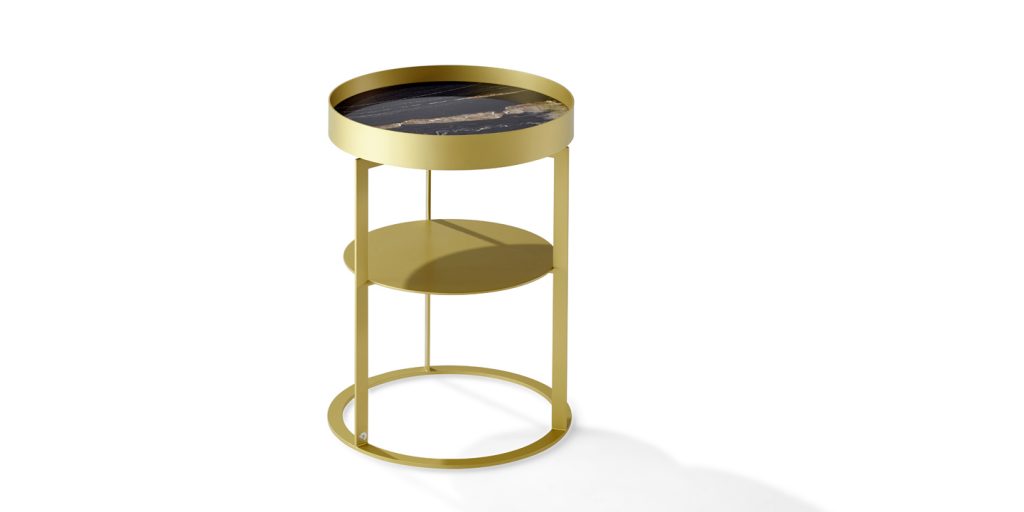 nightstand with compartment made of cylinder-shaped brass base in a gold tone on a white background